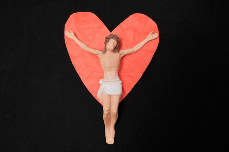 Jesus Christ and Red Heart on a Black Background - Religion Love Conceptの写真素材