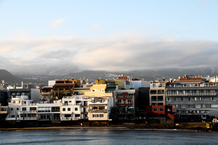 Sea and Building at Sunset in El Medano Tenerife Canary Islandsの写真素材