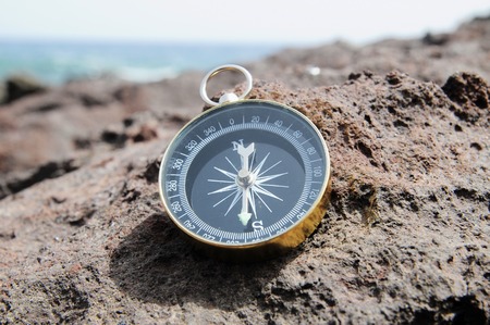 One Compass on the Rocks near the Atlantic Oceanの写真素材