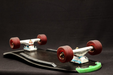 Vintage Style Black Skateboard on a Dark Background