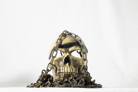 Skull and old Chains on a White Backgroundの写真素材