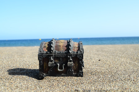 Old Classic Wood and Iron Treasure Chest on the Beachの写真素材
