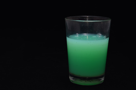 Green Liquid Glass on a Black Backgroundの写真素材