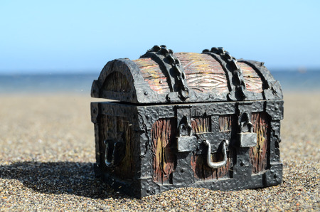 Old Classic Wood and Iron Treasure Chest on the Beachの写真素材