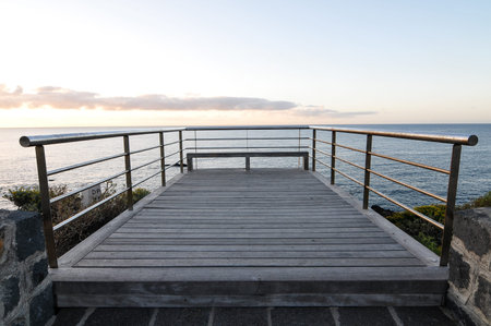 Sunrise on a Pier over Atlantic Ocean in Tenerife Canary Islands Spainの写真素材