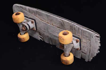 Vintage Style Concued Skateboard on a Black Backgroundの写真素材