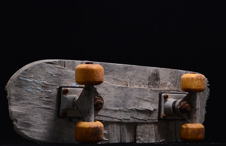 Vintage Style Concued Skateboard on a Black Backgroundの写真素材