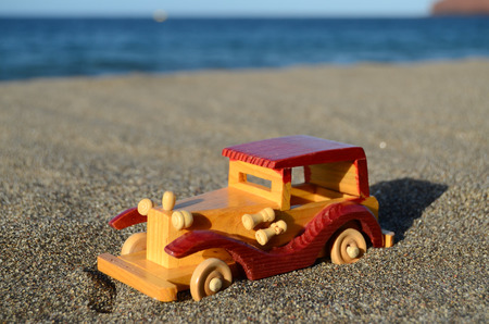 Toy car on Sand Beach Trasportation Conceptの写真素材