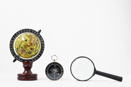Vintage Tools Globe Compass and Loupe on a White Backgroundの写真素材