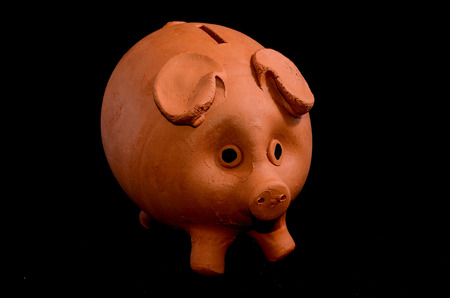 Ceramic Pink Piggy Bank isolated on a Black Backgriundの写真素材