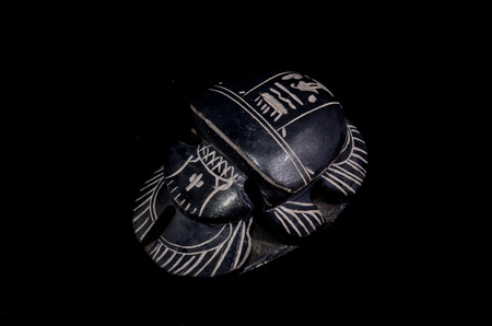Stone Ritual Egyptian Scarab isolated on Black Backgroundの写真素材