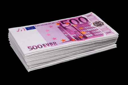 Euro Pile Banknotes Copies over a Black Backgroundの写真素材