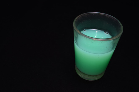 Green Liquid Glass on a Black Backgroundの写真素材