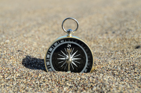Orientation Concept One Compass on the Beach near the Atlantic Oceanの写真素材