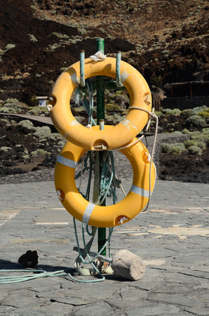 Yellow Life Saver on a Pier in Canary Islands el Hierro Spainの写真素材