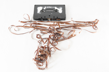 Ancient Vintage Used Musicassette over a White Backgroundの写真素材