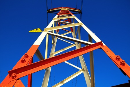 Electric Power Line Pylon over a colored Sunsetの写真素材
