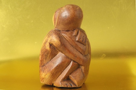 Lovers Sculpture made of Wood on a Gold Backgroundの写真素材