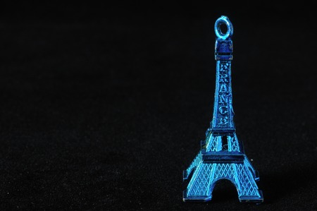 Blue Tour Eiffel Statuette on a Black Backgroundの写真素材