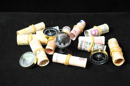 Orientation in Business Compass and Money on a Black Backgroundの写真素材