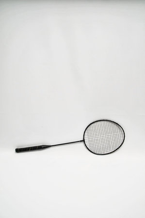 Vintage Old Used Black Racket on a White Background
