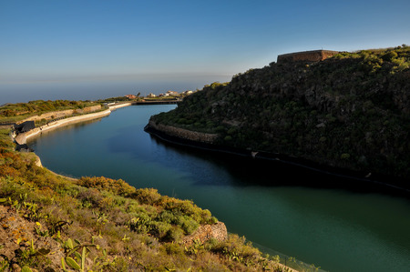 Lake and Dam on a Ravine in Tenerife Canary Islands Spainの写真素材