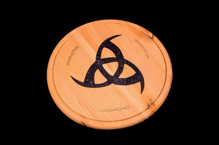 Handmade Typical Tribal Black Sign on a Wooden Surffaceの写真素材