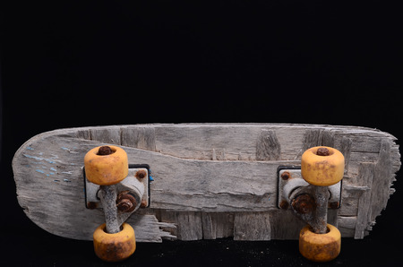 Vintage Style Concued Skateboard on a Black Backgroundの写真素材