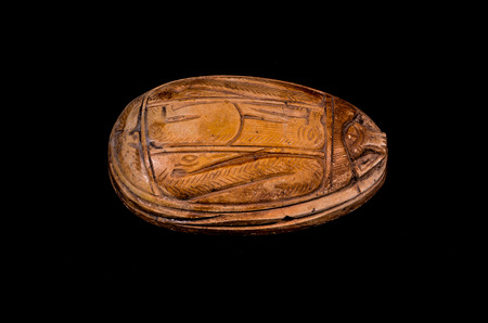 Ritual Egyptian Scarab Stone Isolated on Black Backgroundの写真素材