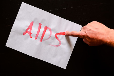 Word Aids Text Writed with Blood on a White Paperの写真素材