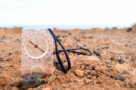 Orientation Concept Metal Compass on a Rock in the Desertの写真素材