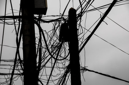 Silhouette of Dangerous Electricity Cables Pylon in Vietnam