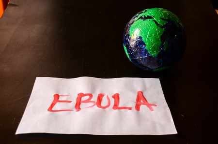 Word Ebola Text Writed with Blood on a White Paperの写真素材