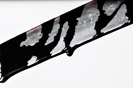 Sharp Katana Sword Blade Dripping Black Color Paintingの写真素材