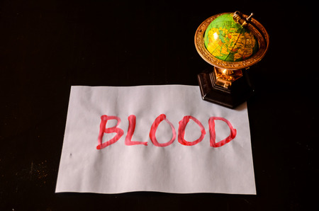 Word Blood Text Writed on a White Paperの写真素材