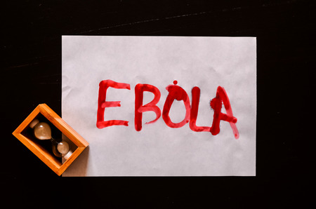 Word Ebola Text Writed with Blood on a White Paperの写真素材