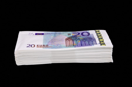 Euro Pile Banknotes Copies over a Black Backgroundの写真素材