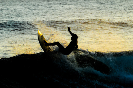 Silhouette Surfer at Sunset in Tenerife Canary Island Spainの写真素材