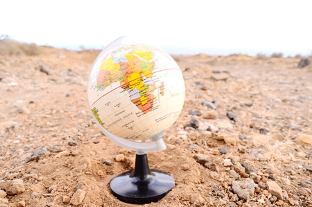Globe Planet Earth in the Rock Desertの写真素材