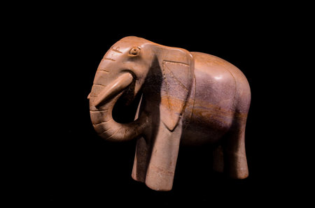 Marble Handmade Statue of an Elephant on Black Backgroundの写真素材