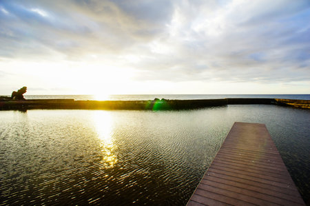 Sunrise on a Pier over Atlantic Ocean in Tenerife Canary Islands, Spainの写真素材