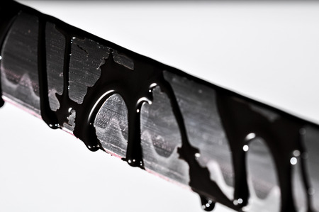 Sharp Katana Sword Blade Dripping Black Color Paintingの写真素材