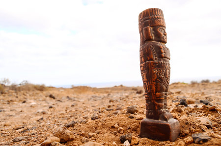 Ancient Maya Statue on the Rocks Desert