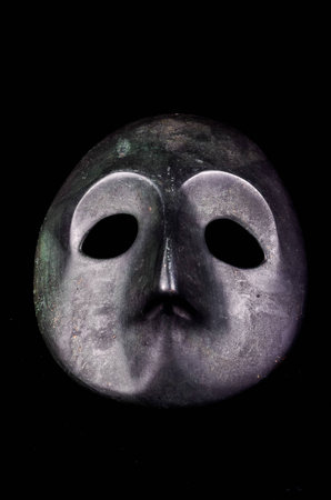 Japanese Metal Medieval Mask on a Black Backgroundの写真素材