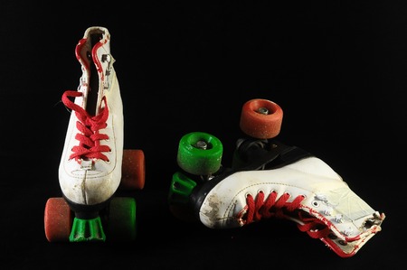 Used Vintage Consumed Roller Skate on a Black Backgroundの写真素材