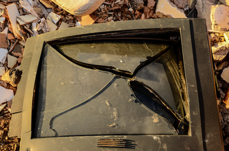 Broken Black Television Abandoned in the Desertの写真素材