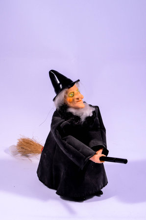 Clay Handmade Statue of a Witch on Black Backgroundの写真素材