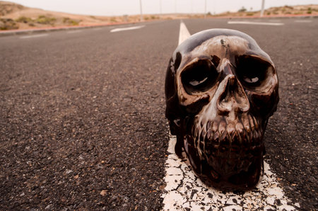 Road Death Concept Skull on the Asphalt Streetの写真素材