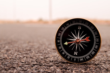 Travel Concept Compass on the Asphlat Roadの写真素材
