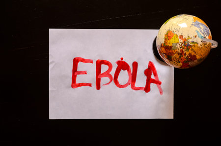 Word Ebola Text Writed with Blood on a White Paper